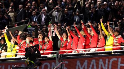 Bruno Fernandes and Harry Maguire of Manchester United lift the League Cup trophy. Getty
