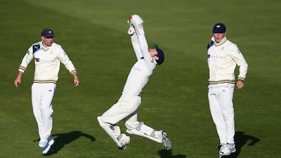 Andrew Hodd the wicketkeeper of Yorkshire leaps high to collect a delivery from Liam Plunkett as Adam Lyth, left, and Gary Ballance look on during day two of the LV County Championship match between Somerset and Yorkshire at The County Ground on April 14, 2014 in Taunton, England. Michael Steele/Getty Images