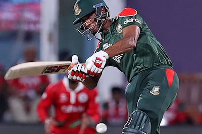 Bangladesh's captain Mohammad Mahmudullah plays a shot during the ICC men's T20 World Cup cricket match between Oman and Bangladesh at the Oman Cricket Academy Ground in Muscat on October 19, 2021. AFP