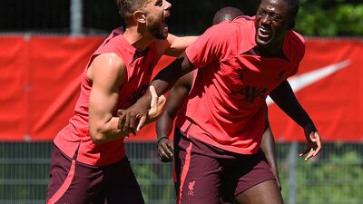 Jordan Henderson and Ibrahima Konate enjoy a joke during Liverpool's pre-season training session.