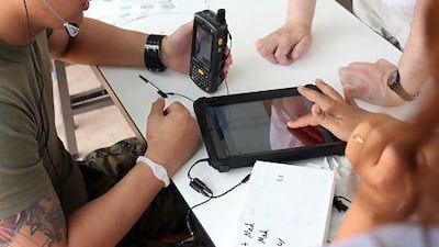 A US Marine uses the Jibbigo voice-to-voice translation application to quickly and accurately translate specific dialects of Arabic. Courtesy Jibbigo