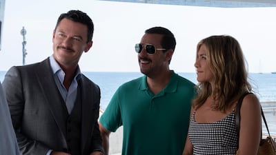 Luke Evans, Adam Sandler and Jennifer Aniston in 'Murder Mystery'. Courtesy Netflix
