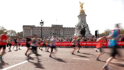 Runners pass Buckingham Palace during the London Marathon on April 22, 2018. Andrew Boyers / Reuters
