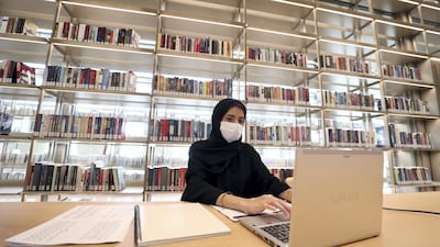 Sara works on her laptop. Chris Whiteoak / The National