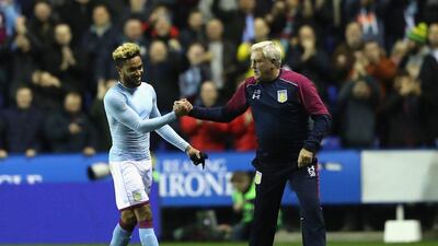 Aston Villa manager Steve Bruce congratulates Jordan Amavi after their win on Tuesday night. Warren Little / Getty Images