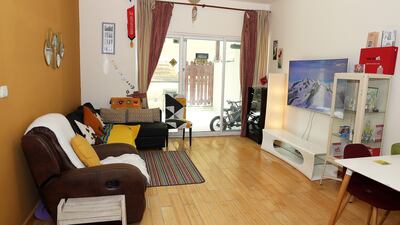 The living room also includes a dining area