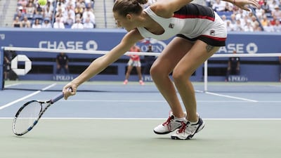 Karolina Pliskova of the Czech Republic hits a return to Angelique Kerber. Jason Szenes / EPA