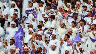 Al Ain fans celebrate after their team go ahead in the President's Cup final against Al Wasl. Victor Besa / The National