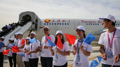 Visitors holding Chinese and EU flags stand next to the first Airbus A330. The French firm and is US rival Boeing are pinning their hopes on the growing Chinese market for bigger jets. Ramon Pilipey/ EPA