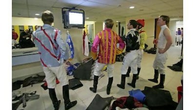 Jockeys review tapes before a race. Photographs by Mike Young / The National