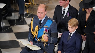 Prince William and Prince George, who have both seen their titles adjusted following Queen Elizabeth II's death, at the late monarch's funeral on Monday. AFP
