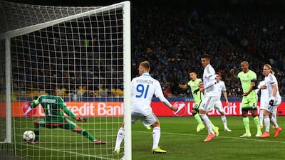 KIEV, UKRAINE - FEBRUARY 24: Sergio Aguero #10 of Manchester City scores the opening goal past goalkeeper Oleksandr Shovkovskiy of Dynamo Kiev during the UEFA Champions League round of 16, first leg match between FC Dynamo Kyiv and Manchester City FC at the Olympic Stadium on February 24, 2016 in Kiev, Ukraine. (Photo by Michael Steele/Getty Images)