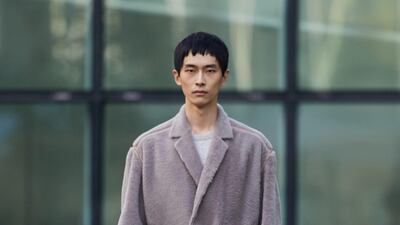 A relaxed, loosely belted jacket and loose-fit trousers, by Ermenegildo Zegna for autumn / winter 2021. Courtesy Ermenegildo Zegna