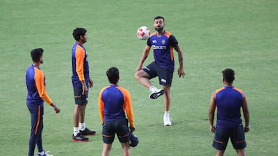 Virat Kohli playing football with India teammates during training on March 8. AP