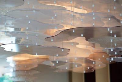 Cloud-inspired chandeliers in the main dining room. Photo: Mayg