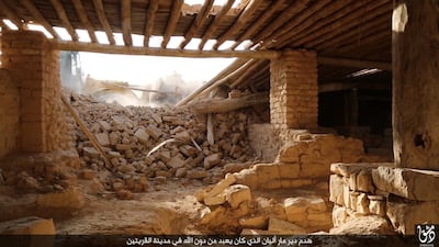 An image published by the media branch of ISIL on August 21, allegedly shows militants using a bulldozer to destroy the ancient Syriac Catholic monastry of Mar Elian in the central Syrian town of Al Qaryatain. AFP Photo