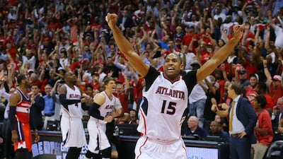 Al Horford of the Atlanta Hawks celebrates making the last-second winning shot against the Washington Wizards on Wednesday in Game 5 of their NBA play-offs second round series. Curtis Compton / Atlanta Journal-Constitution / AP / May 13, 2015