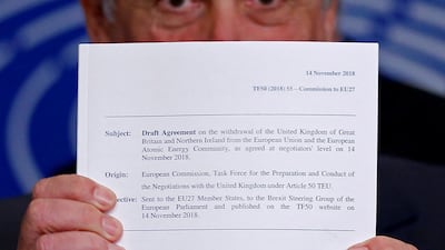 European Parliament President Antonio Tajani displays the agreement of the withdrawal of the UK from the EU at a news conference about Brexit at the European Parliament. Reuters