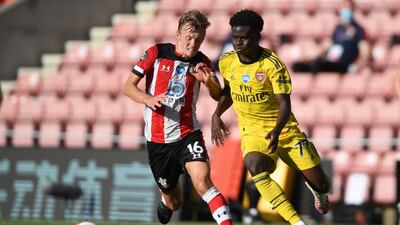 Southampton midfielder James Ward-Prowse vies with Arsenal's Bukayo Saka. AFP