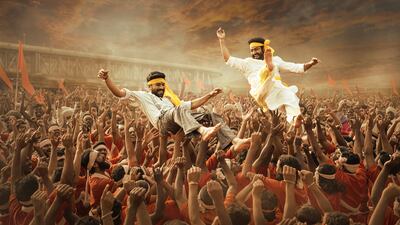 This image released by Netflix shows Ram Charan and N. T. Rama Rao Jr. in a scene from "RRR. " (Netflix via AP)