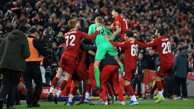 Liverpool players celebrate at the end of their League Cup win over Arsenal at Anfield. AP