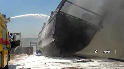 A screen grab taken from a from Iranian State TV Irib shows firefighters combatting a blaze at the Delvar Kashti Bushehr boat factory in the Iranian city of Bushehr. AFP PHOTO, HO IRIB