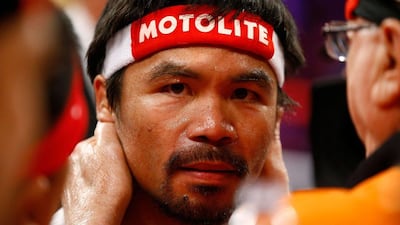 Manny Pacquiao unanimously lost his fight to Floyd Mayweather after a 12-round bout on Sunday morning. Al Bello / Getty Images / AFP / May 3, 2015