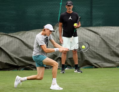 Jannik Sinner practises ahead of last year's Wimbledon Championships as coach Darren Cahill watches. Getty Images
