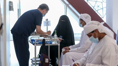 Nurses speak with patients at the Seha Vaccination Centre, Abu Dhabi Cruise Terminal, Zayed Port.