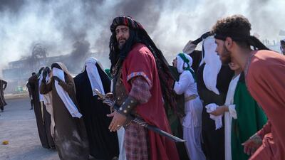 Shiite Muslims re-enact the 7th century battle of Karbala during activities marking Ashura, in the Sadr City district of Baghdad, Iraq. AP