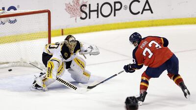 Florida Panthers center Brandon Pirri, right, scores the game winning goal against Boston Bruins goalie Tuukka Rask during a shootout in Sunrise, Fla., Saturday, March 21, 2015. The Panthers won 2-1. (AP Photo/Alan Diaz)