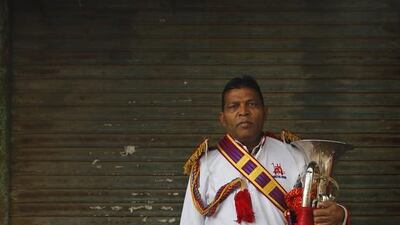 Mohammad Gore from Sambal, a member of Master Band specializing in playing weddings, poses for a portrait in New Delhi.