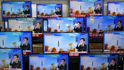 Television screens show a news report about the latest North Korean missile launch with file footage of a North Korean missile test, at an electronic market in Seoul. North Korea fired one long-range and two short-range ballistic missiles on November 3, Seoul's military said, with one prompting warnings for residents of a South Korean island and people in parts of northern Japan to seek shelter. AFP