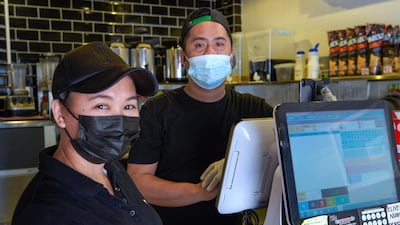 (Erlie Lico (left), with Mark Tan at Ochado Bubble Tea Café, feels fortunate not to have been caught up in the explosion. Victor Besa / The National