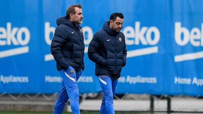 Barcelona coach Xavi (R) prepares to face Real Madrid. AFP