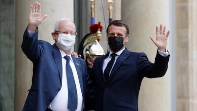 French President Emmanuel Macron, right, greets Israel's President Reuven Rivlin as he arrives for a meeting and lunch at the Elysee Palace in Paris on Thursday. EPA