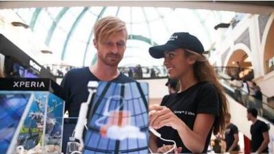 Denis Kruger, from Dubai firm pIxelbug, takes a look at the virtual reality game for a waterproof phone. Lee Hoagland/The National.