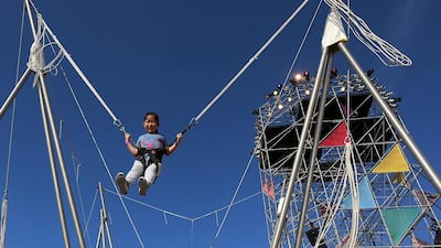 Children take part in the Bounce activity on the final day of the Mother of the Nation Festival along the corniche in Abu Dhabi.