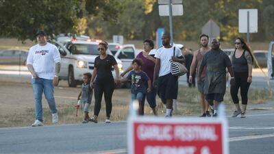 People leave the Gilroy Garlic Festival following a deadly shooting. AFP