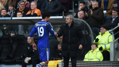 Chelsea manager Jose Mourinho shakes hands with Diego Costa as he subs off during Sunday's Premier League win over Hull City. Michael Regan / Getty Images / March 22, 2015