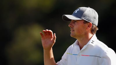 Jordan Spieth waves to the crowd on the 18th hole during the final round of the Hyundai Tournament of Champions on Monday. Tom Pennington / AFP