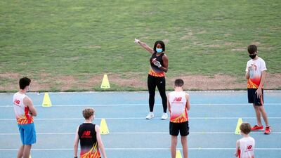 Coach Lisa Campbell oversees training in Dubai as athletes maintain social distancing. Chris Whiteoak / The National