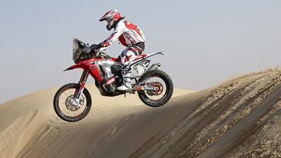 Paulo Goncalves jumps a dune during Day 2 of the Abu Dhabi Desert Challenge on April 7 2014. Goncalves is third in the motorcycle class behind KTM teammates Marc Coma and Sam Sunderland. Courtesy Abu Dhabi Desert Challenge