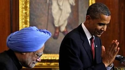 The US president, Barack Obama, greets the audience as he stands beside India’s prime minister, Manmohan Singh, at Parliament House in New Delhi yesterday.