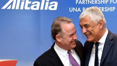 James Hogan, left, president and chief executive of Abu Dhabi airline Etihad Airways, and Italian flag carrier Alitalia CEO Gabriele del Torchio during a press conference during which they signed an alliance agreement. Alberto Pizzoli / AFP