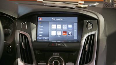 The OpenAir I1.3 infotainment system on display in a car at the International CES in Las Vegas. The technology allows you to to access your smartphone and its apps from the touch screen in your car. John Locher / AP Photo