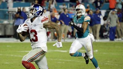 New York Giants wide receiver Odell Beckham runs for a touchdown against the Miami Dolphins in the NFL on Monday. Wilfredo Lee / AP / December 14, 2015