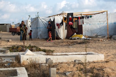 Palestinians displaced from eastern Khan Younis set up shelters in a cemetery in the west of the city in southern Gaza. AFP