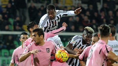 Juventus' Patrice Evra, top left, and Paul Pogba, jump for the ball during the Serie A soccer match between Palermo and Juventus, in Palermo, Italy, Sunday Nov. 29, 2015. (AP Photo/Alessandro Fucarini)