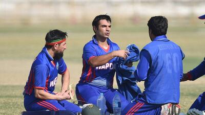 Salman Butt, centre, is back on the cricket pitch and is targeting a return to the Pakistan team. Rizwan Tabassum / AFP